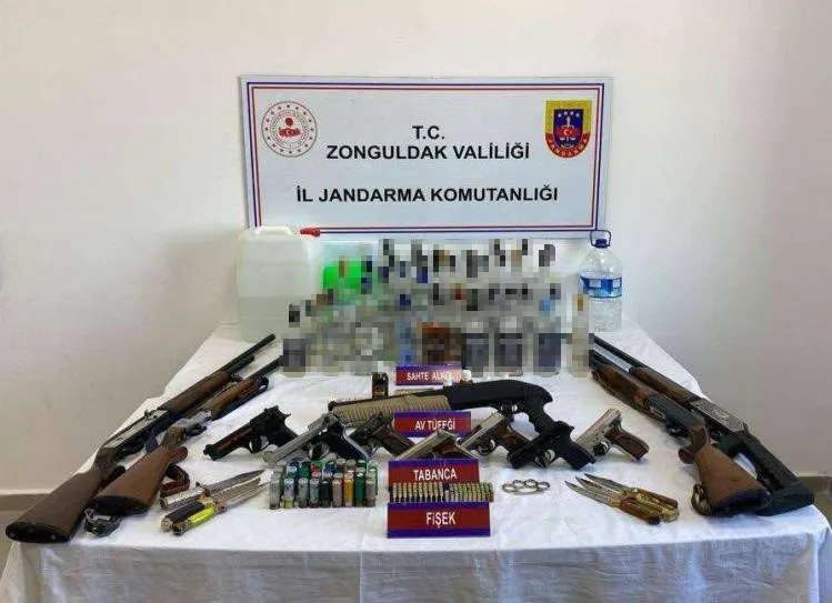 Çok sayıda sahte içki ve silah ele geçirildi